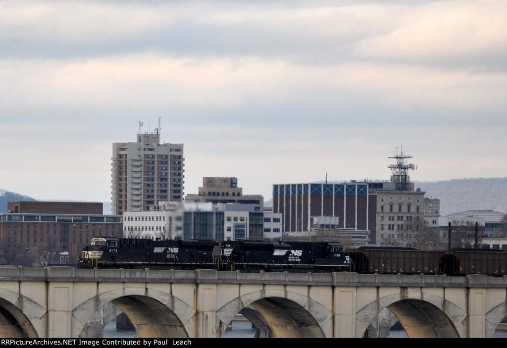 Empty coal train rolls west over the bridge